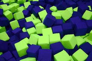 Many colorful soft blocks in a kids' ballpit at a playground photo