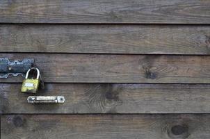 The texture of wooden wall with golden lock photo