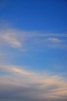 A photo of a bright and shiny blue sky with fluffy and dense white clouds