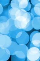 Blue Festive Christmas elegant abstract background with many bokeh lights. Defocused artistic image photo