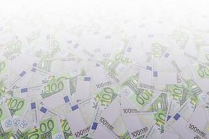 Front part of 100 euro banknote close-up with small green details photo