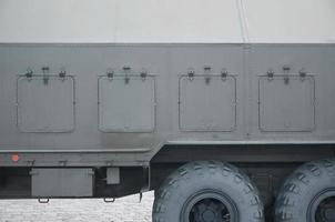 Close up of green military truck. Modern military transportation vehicle technologies photo