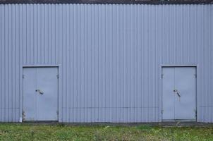 Metal wall with two doors photo