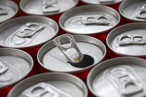 Many aluminium soda drink cans. Advertising for Soda drinks or tin cans mass manufacturing photo