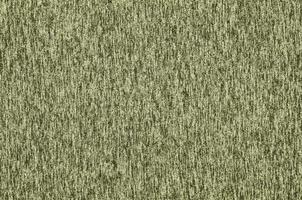Real heather knitted fabric made of synthetic fibres textured background. Colored fabric texture. Background with delicate striped pattern photo