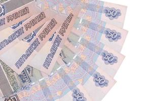 50 russian rubles bills lies isolated on white background with copy space stacked in fan shape close up photo