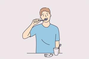 Dental hygiene and health concept. Young positive man cartoon character standing and cleaning teeth woth toothbrush and paste in bathroom vector illustration