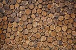 Decorative fence of wooden blocks photo