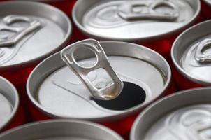 Many aluminium soda drink cans. Advertising for Soda drinks or tin cans mass manufacturing photo