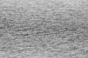 Close-up of heater and knitted jersey fabric textured cloth background with delicate striped pattern photo