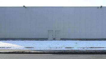 Texture of a high metal wall of an industrial building without windows photo