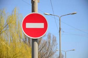 Road sign in the form of a white rectangle in a red circle. No entry photo