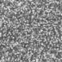 Blurred silver decorative sequins. Background image with shiny bokeh lights from small elements photo