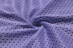 Texture of sportswear made of polyester fiber. Outerwear for sports training has a mesh texture of stretchable nylon fabric photo