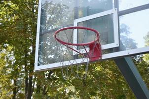 Outdoor Basketball backboard with clear blue sky photo