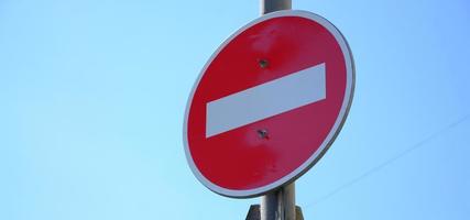 Road sign in the form of a white rectangle in a red circle. No entry photo