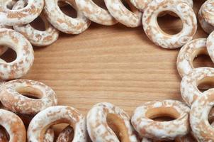 Glazed bagels on wooden table photo