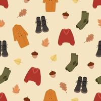 Collection of different autumn clothes. Casual sweater, coat, boots, socks. Seamless pattern. Flat graphic vector illustration
