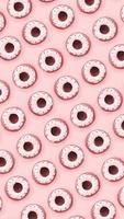 Many small plastic donuts lies on a pastel colorful background. Flat lay minimal pattern. Top view photo