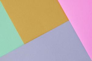 Texture background of fashion pastel colors. Pink, violet, orange and blue geometric pattern papers. photo