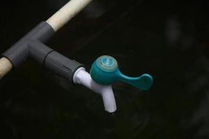 photo of the water faucet in the blue pool