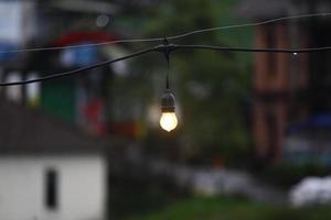 photo of a small lamp hanging in the afternoon