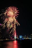 fireworks on the river in the dark sky photo