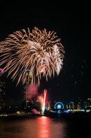 fireworks on the river in the dark sky photo