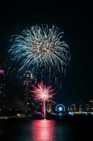 fireworks on the river in the dark sky photo