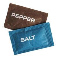 single dose salt and pepper sachet isolated over white photo