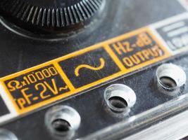 electrical symbol on vintage analog multimeter photo