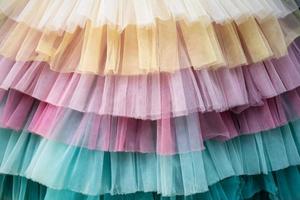 Fabric multicolored textured background. Details of a beautiful bright dress. Flatley. Copy space. photo