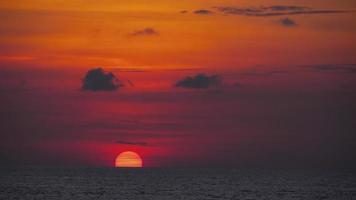 Dramatic red sunset over the Sea. A bright fiery sunset among the clouds. The rapid motion of the clouds. Seascape. video