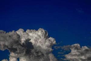 The image of beautiful black clouds continually moving. , background blue sky photo