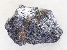 raw galena stone with chalcopyrite vein on white photo
