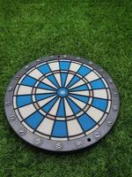 Dart with grass green background. photo
