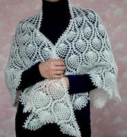 White downy shawl on shoulders. Orenburg downy shawl photo