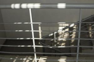 Railing on stairs. Interior in building. Handrail for support. photo