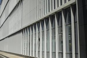 Building is outside. Windows in building. Vertical lines in architecture. photo