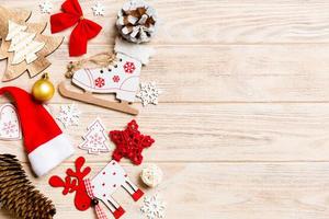 Top view of Christmas decorations and toys on wooden background. Copy space. Empty place for your design. New Year concept photo