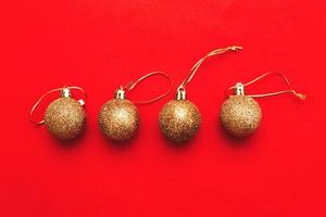 Gold Christmas balls on a red background photo