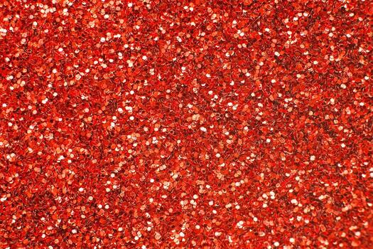 glittering background of red sequins closeup. Sparkle festive texture photo