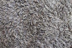 The texture of gray carpet. Fleecy surface background photo