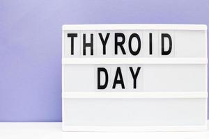 inscription international thyroid day on purple background. copy space photo