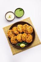 sabudana wada or shabudana vada called in india made from sago and served with chutney photo