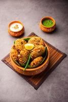 sabudana wada or shabudana vada called in india made from sago and served with chutney photo