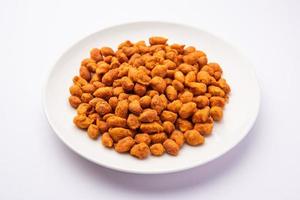 Masala Peanuts are spicy and crunchy snack coated in chickpea flour, Indian snack photo