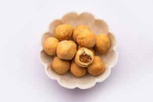 Dry kachori is a dry fruits stuffed ball shaped farsan also called kachauri, kachodi and katchuri photo