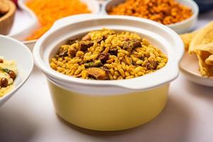 Indian Tea time snacks in group. Sev, chivda, farsan, mixture, bakarwadi served in different bowls photo