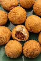 Dry kachori is a dry fruits stuffed ball shaped farsan also called kachauri, kachodi and katchuri photo